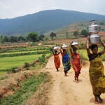 Porja Women Approching their Village with Water Containers