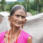 Sonjani Gomango, displaying her traditonal tattoo marks, jewellery and enlarged earlobes.